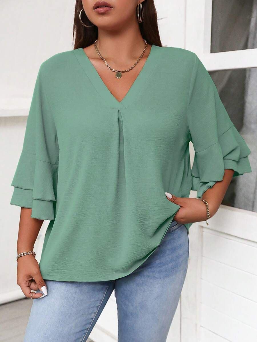 Effen blouse met uitlopende mouwen en v-hals OXL